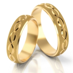 Półokrągłe zdobione złote obrączki ślubne próby 585
